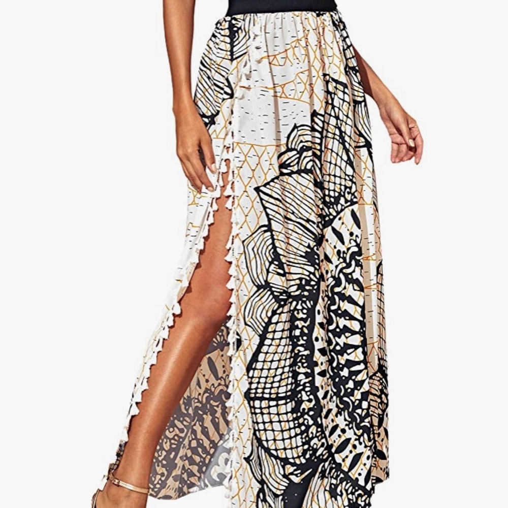 High waisted maxi skirt with floral pattern and black band. Size medium